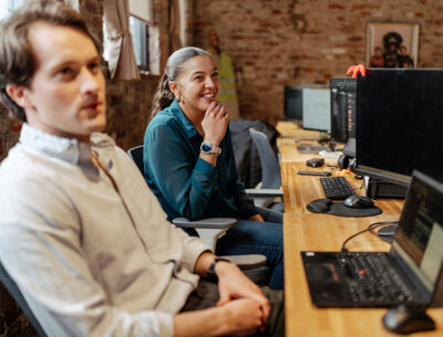 Sandbox team members in front of computers