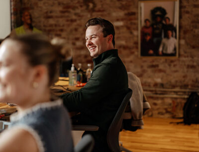 Sandbox Team member smiling during meeting