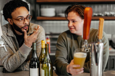 Sandbox team member talking at the bar