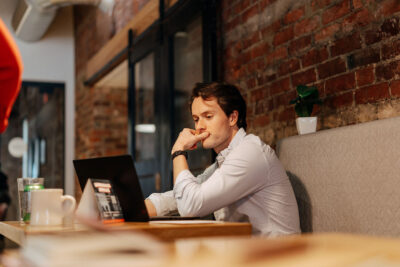 Sandbox team member working at laptop