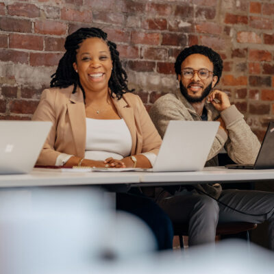 Sandbox team members smiling during meeting